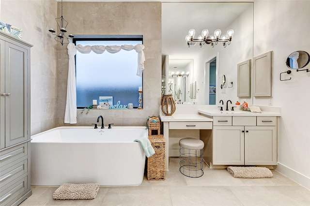 full bathroom with vanity, tile patterned flooring, a freestanding tub, and tile walls