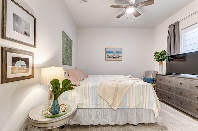 bedroom featuring visible vents, ceiling fan, and carpet flooring