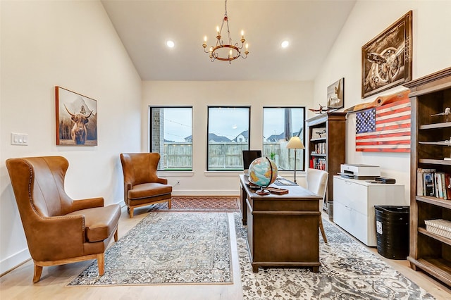 home office featuring lofted ceiling, recessed lighting, light wood-style flooring, an inviting chandelier, and baseboards