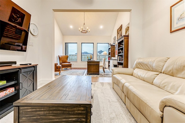 living room featuring light wood finished floors, lofted ceiling, recessed lighting, a chandelier, and baseboards