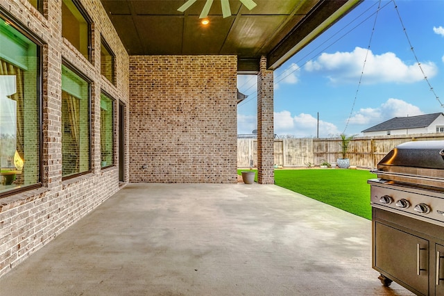 view of patio / terrace featuring a fenced backyard, a grill, and a ceiling fan