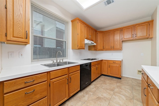 kitchen featuring light countertops, visible vents, a sink, under cabinet range hood, and black appliances