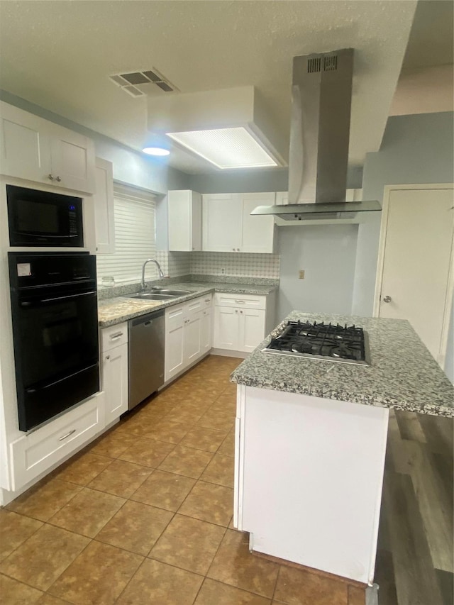 kitchen featuring light stone counters, white cabinets, island exhaust hood, and black appliances