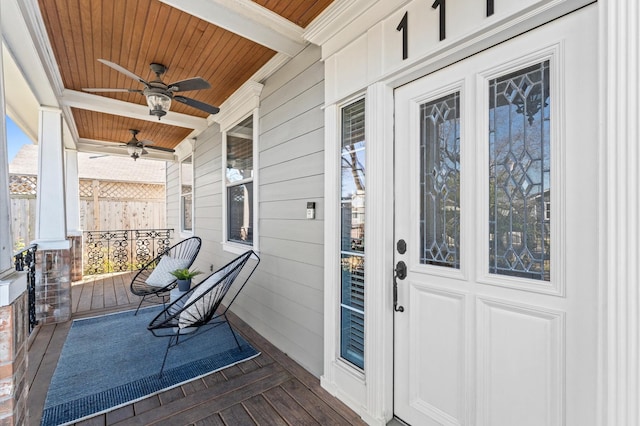 entrance to property with covered porch and ceiling fan