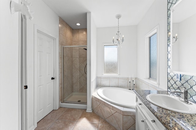 full bath with tile patterned flooring, a shower stall, a bath, and vanity