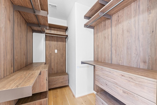 walk in closet with light wood-style floors and visible vents