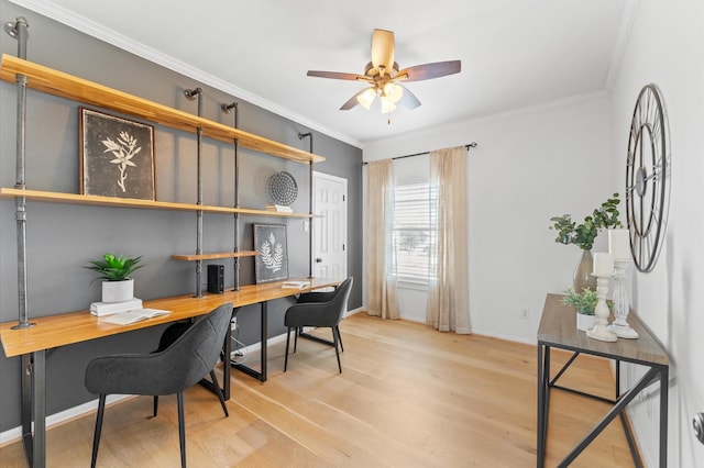 office area with ornamental molding, wood finished floors, a ceiling fan, and baseboards