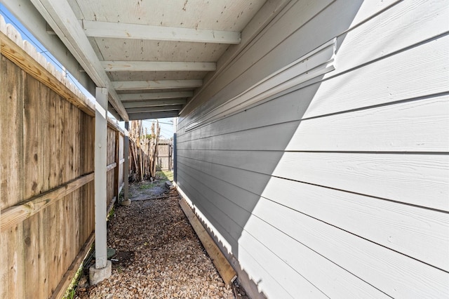 view of side of property featuring fence