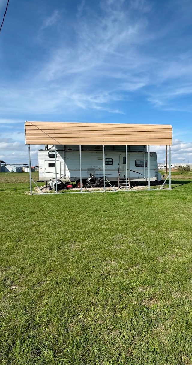 view of outdoor structure with a detached carport