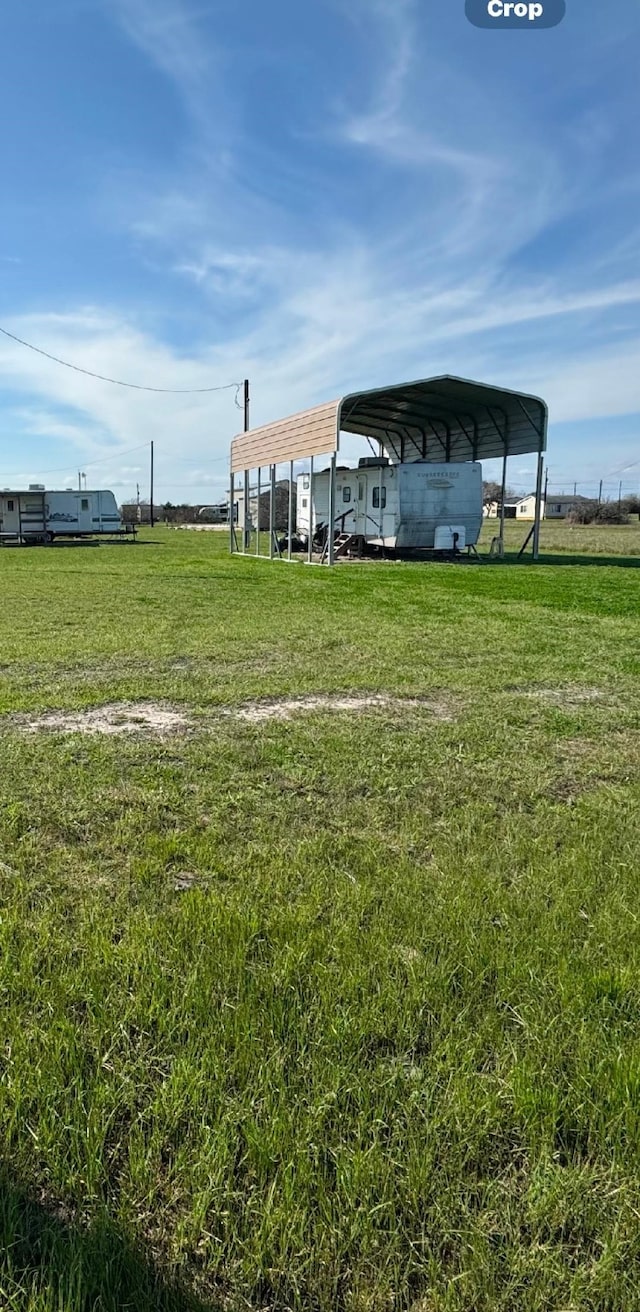 view of yard with a carport