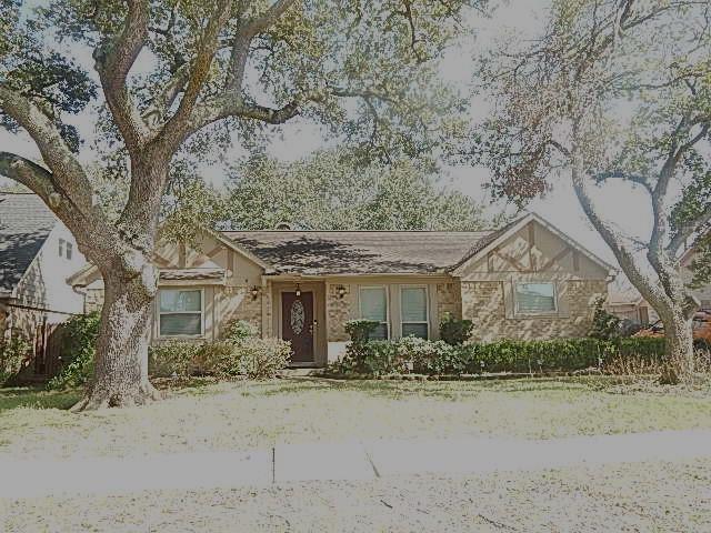 ranch-style home with stone siding