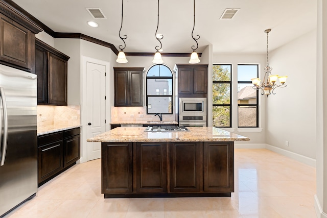 506 Knox St, Houston, TX 77007 - kitchen with stainless steel appliances, backsplash, a kitchen island with sink, light stone countertops, and recessed lighting