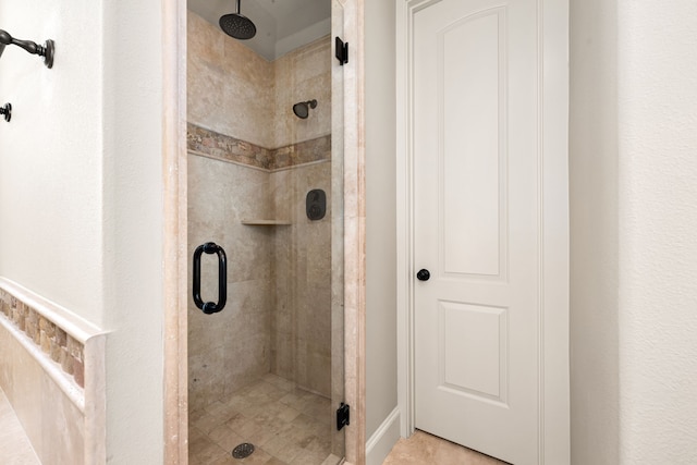 bathroom with a shower stall