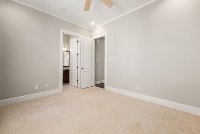 unfurnished bedroom featuring recessed lighting, ornamental molding, light carpet, connected bathroom, and baseboards