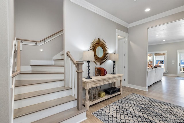 staircase with recessed lighting, baseboards, wood finished floors, and crown molding