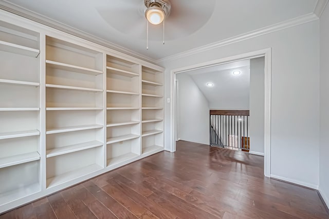 unfurnished room with ceiling fan, dark wood finished floors, and crown molding