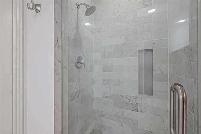 full bath featuring a shower stall