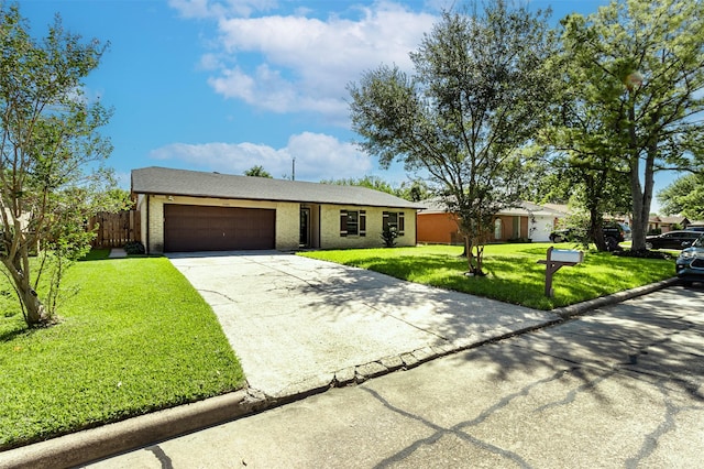 ranch-style house featuring concrete driveway, a front lawn, an attached garage, and brick siding