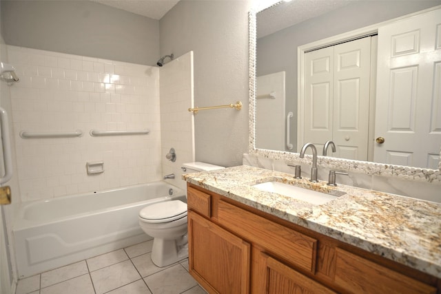 bathroom with vanity, toilet, tile patterned flooring, and bathing tub / shower combination