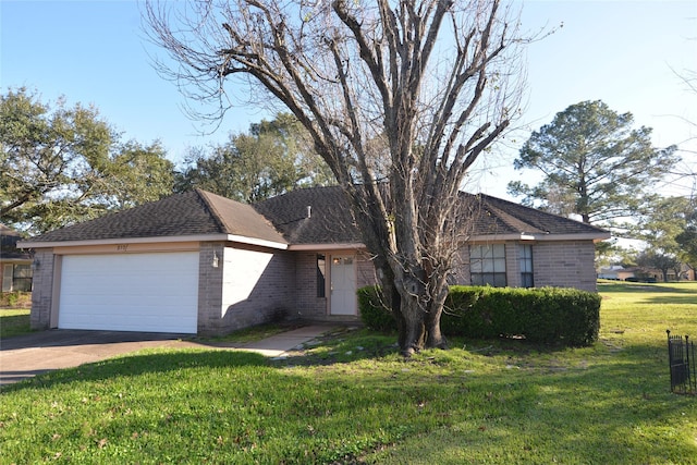 ranch-style home featuring a garage, concrete driveway, brick siding, and a front yard