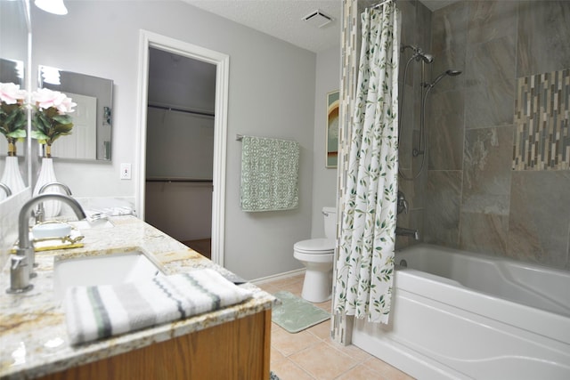bathroom with toilet, a textured ceiling, shower / bath combo with shower curtain, and tile patterned floors