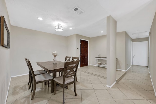 dining area with light tile patterned floors, attic access, visible vents, baseboards, and recessed lighting