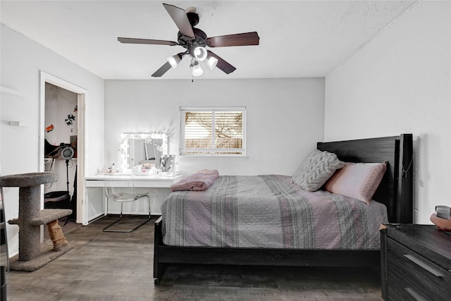 bedroom featuring a ceiling fan and dark wood-style flooring