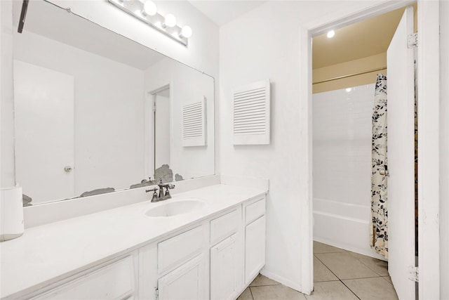 bathroom featuring tile patterned flooring, shower / bath combination with curtain, and vanity