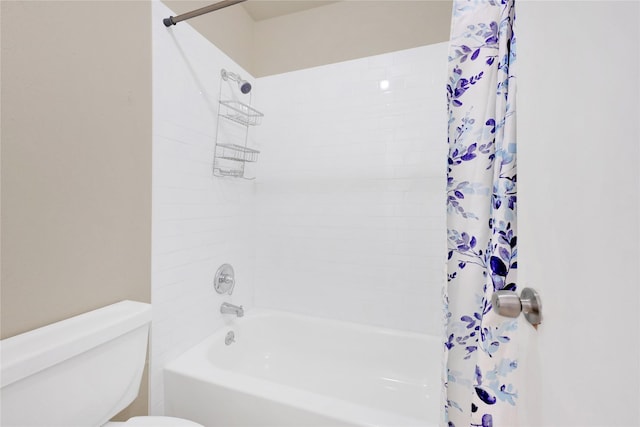 full bath with shower / bath combo with shower curtain and toilet