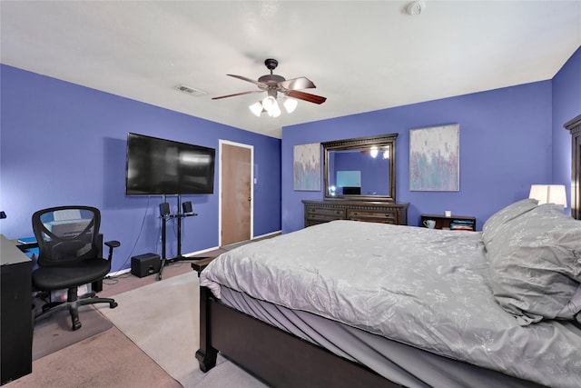 bedroom with visible vents, ceiling fan, light carpet, and baseboards