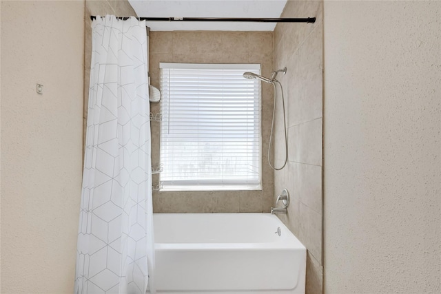 full bathroom featuring shower / bath combo with shower curtain