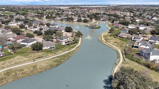 drone / aerial view featuring a residential view and a water view