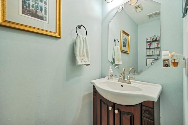 bathroom featuring visible vents and vanity