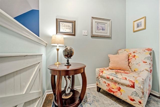 living area featuring baseboards