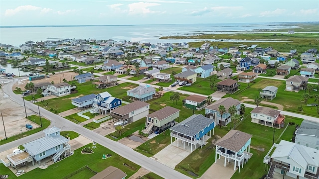 aerial view featuring a residential view and a water view