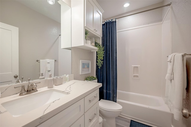 bathroom with toilet, wood finished floors, shower / bath combination with curtain, and vanity