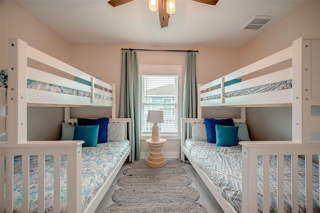 bedroom featuring baseboards, visible vents, and a ceiling fan