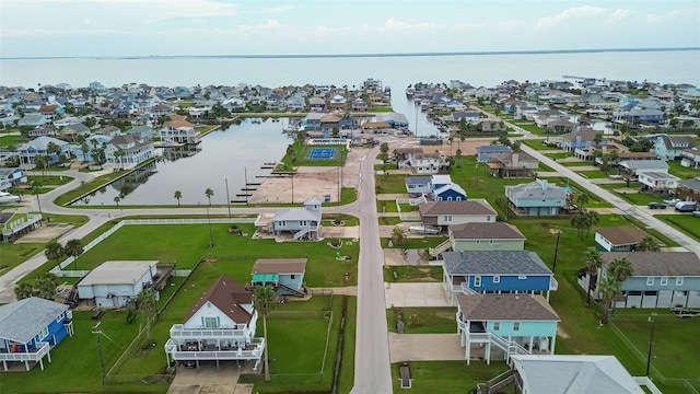 birds eye view of property featuring a water view and a residential view