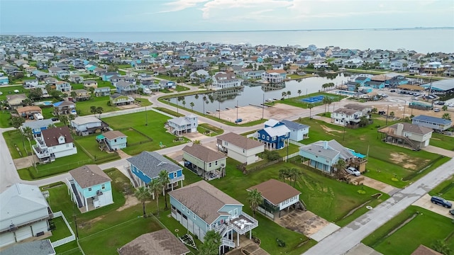 birds eye view of property featuring a residential view and a water view