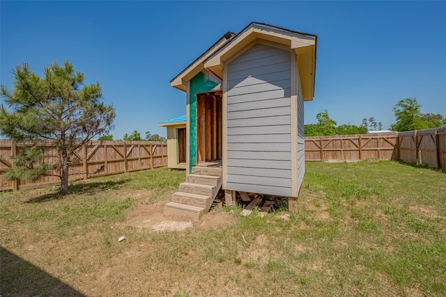 view of outdoor structure with a fenced backyard