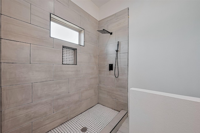 full bathroom with a tile shower