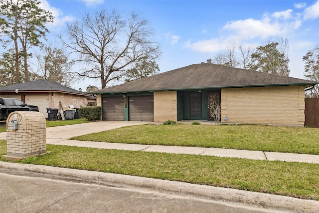 view of front of house with an attached garage, brick siding, driveway, roof with shingles, and a front lawn