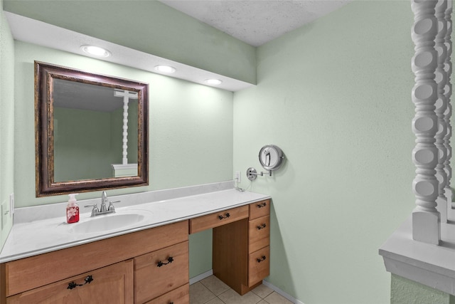 bathroom with tile patterned flooring and vanity