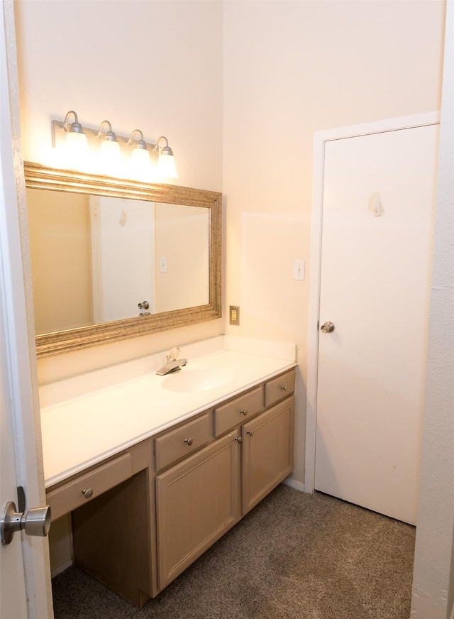 bathroom with carpet floors and vanity