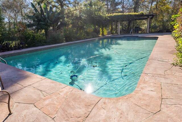 outdoor pool featuring a pergola