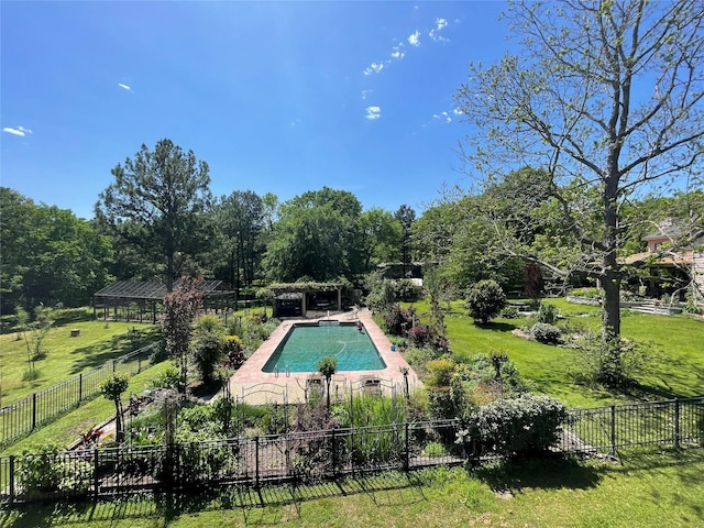 view of swimming pool featuring a yard, fence, and a fenced in pool