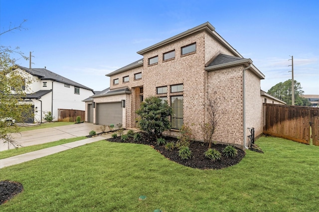 view of front of home featuring a garage, driveway, a front yard, and fence