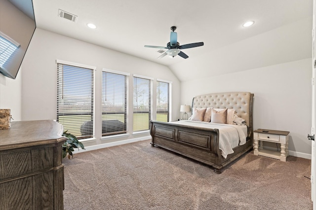 carpeted bedroom featuring lofted ceiling, visible vents, baseboards, and recessed lighting