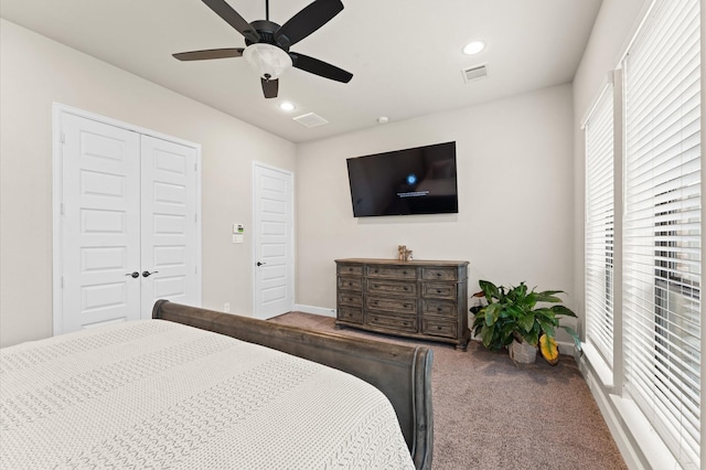 carpeted bedroom with recessed lighting, a ceiling fan, baseboards, visible vents, and a closet