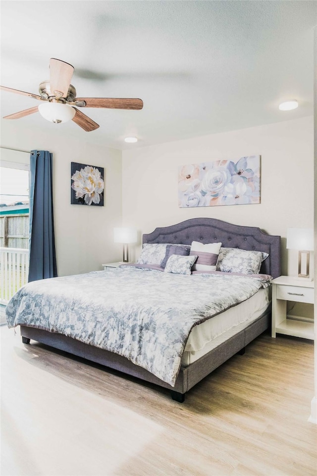 bedroom featuring ceiling fan and wood finished floors